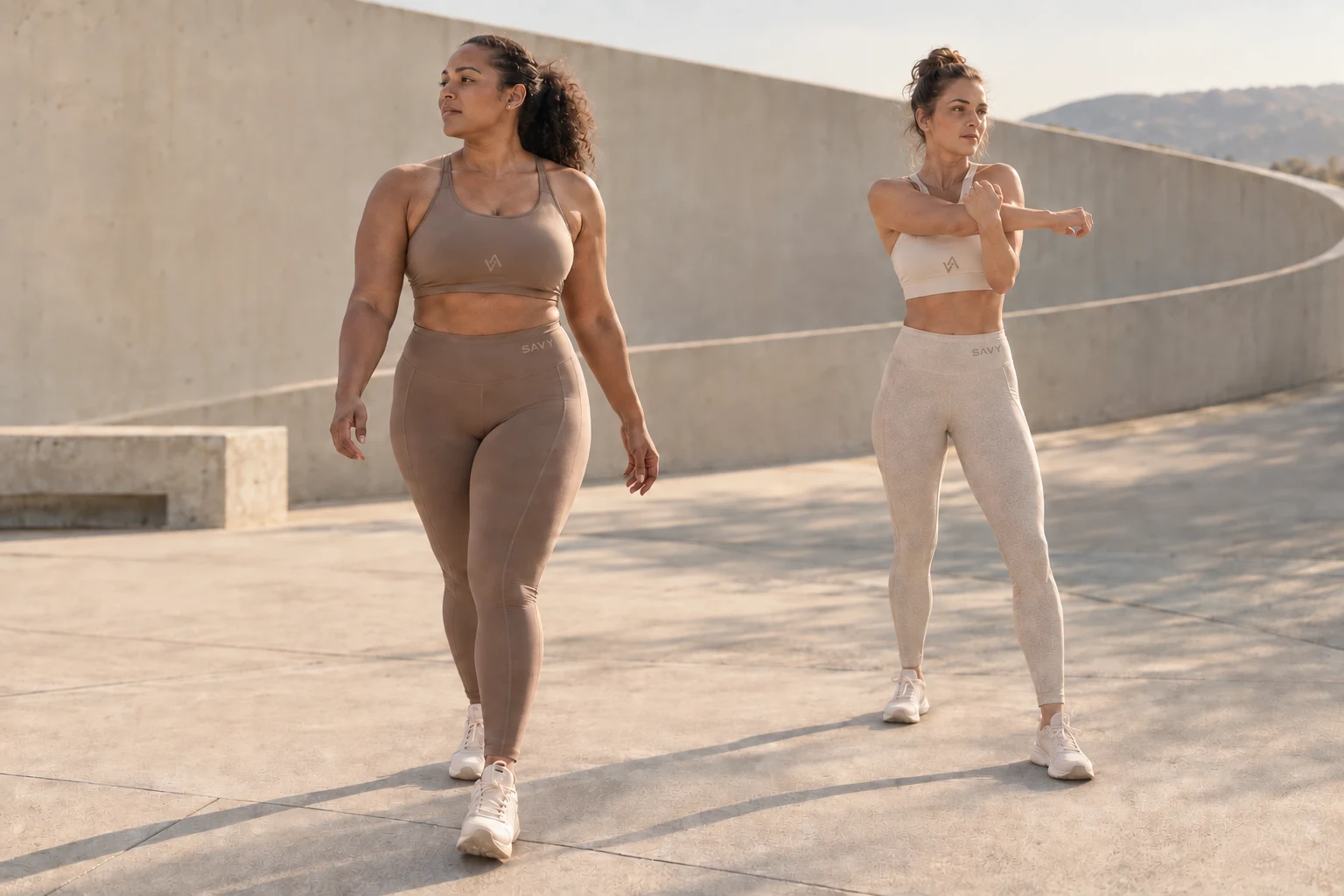Two women moving together in warm morning light